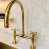 O The Artisan Gold Bridge Kitchen Faucet with Matching Side Sprayer